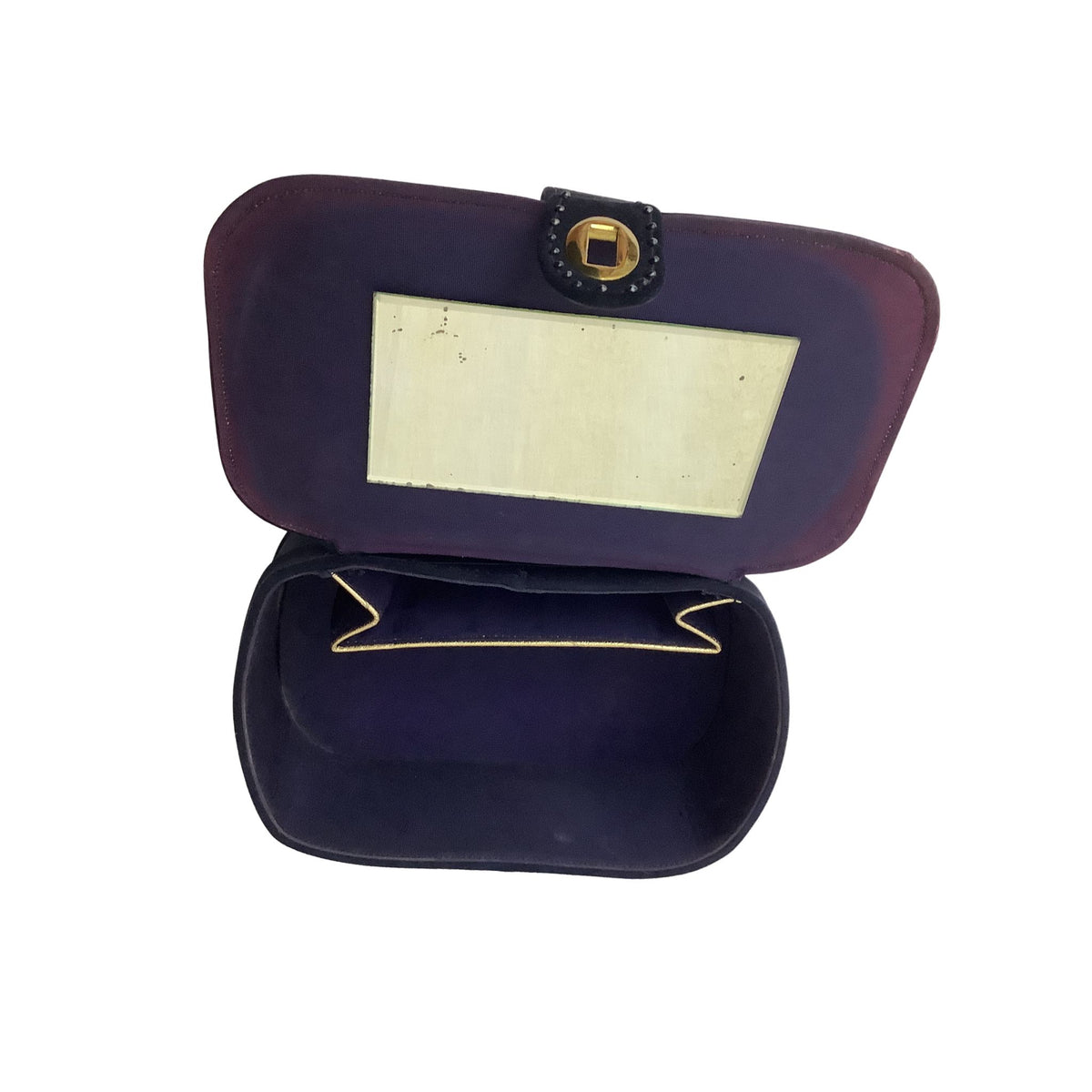 Interior view of vintage Stylecraft black purse showing purple discoloration, gold trimmed interior pocket and mirror.