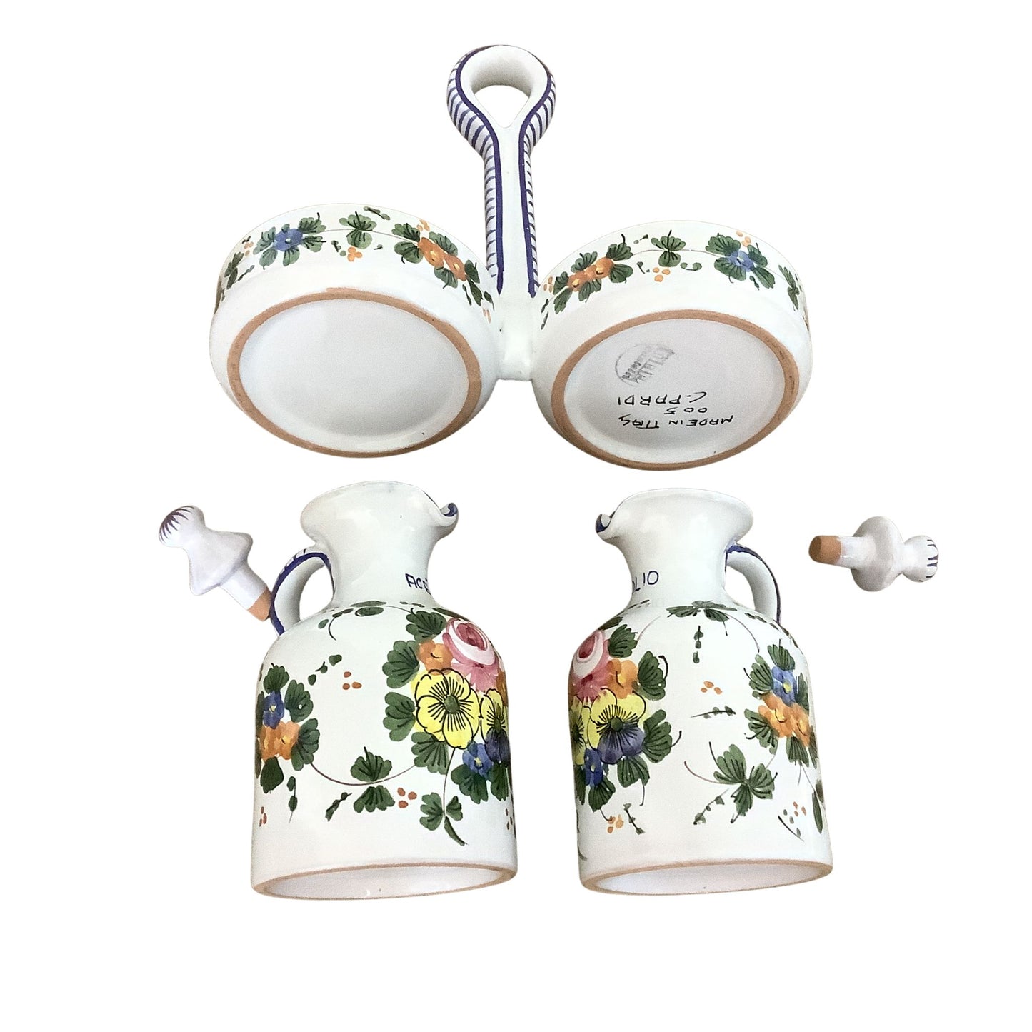 Italian ceramic cruet set with floral designs top-flat view on a white background