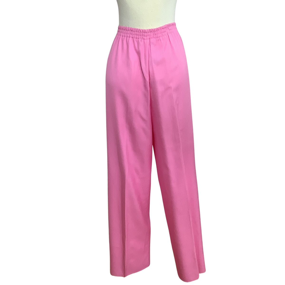 Women's vintage pink wide-leg trousers displayed on a mannequin lower torso against a plain white background.