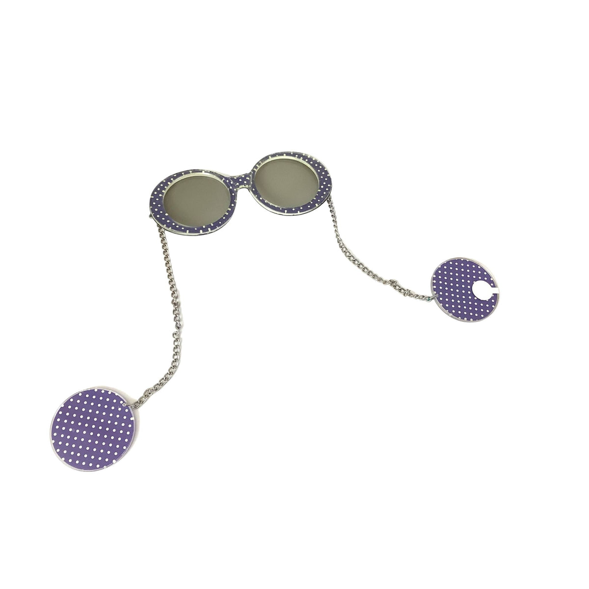 Vintage novelty sunglasses with round frames, gray lenses, and purple-and-white polka-dot fabric frames and earrings connected by a silver chain.