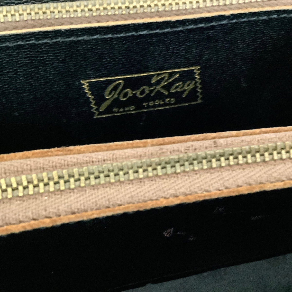 Joo-Kay Tooled Bag close-up, label view.