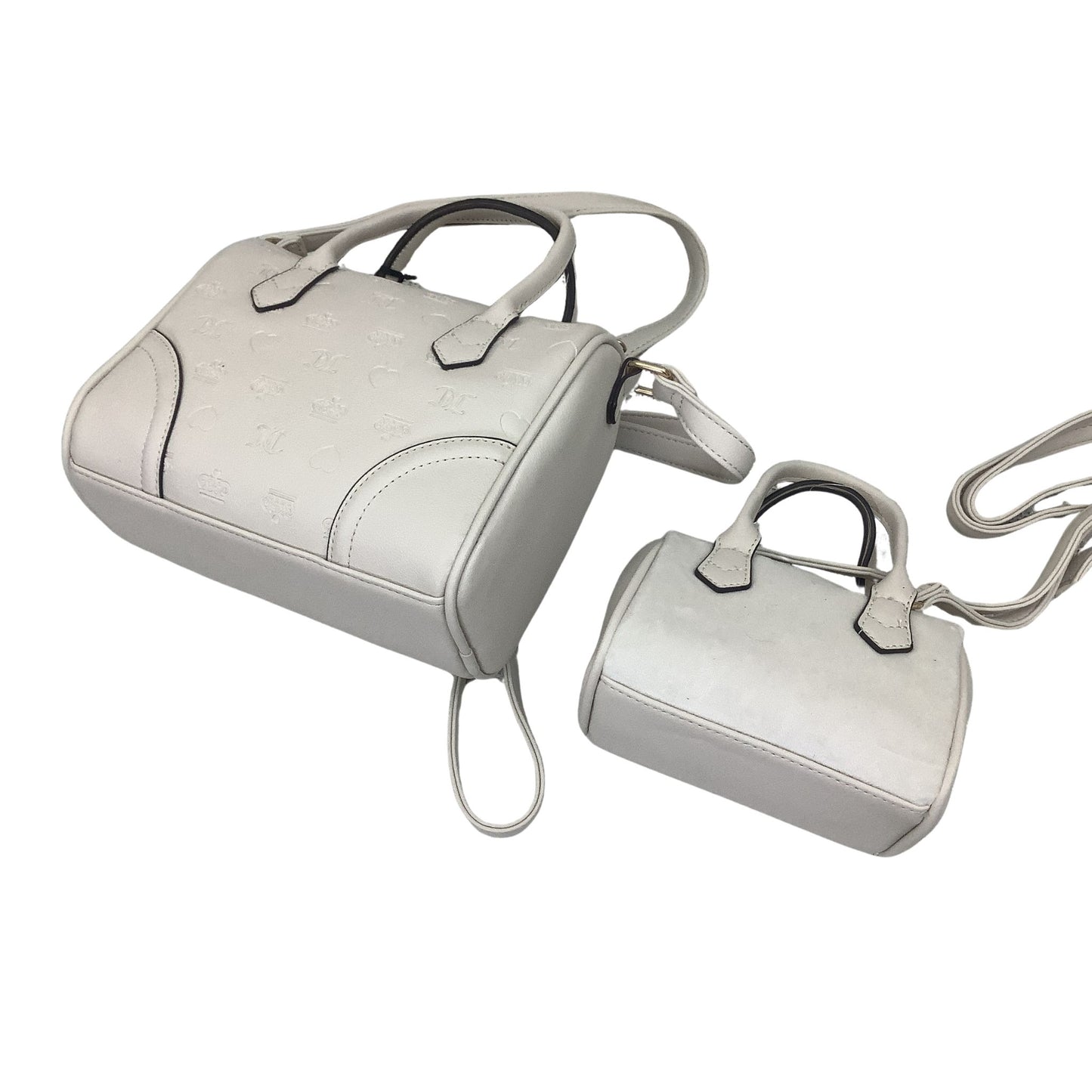 Back view of two beige handbags on a white background