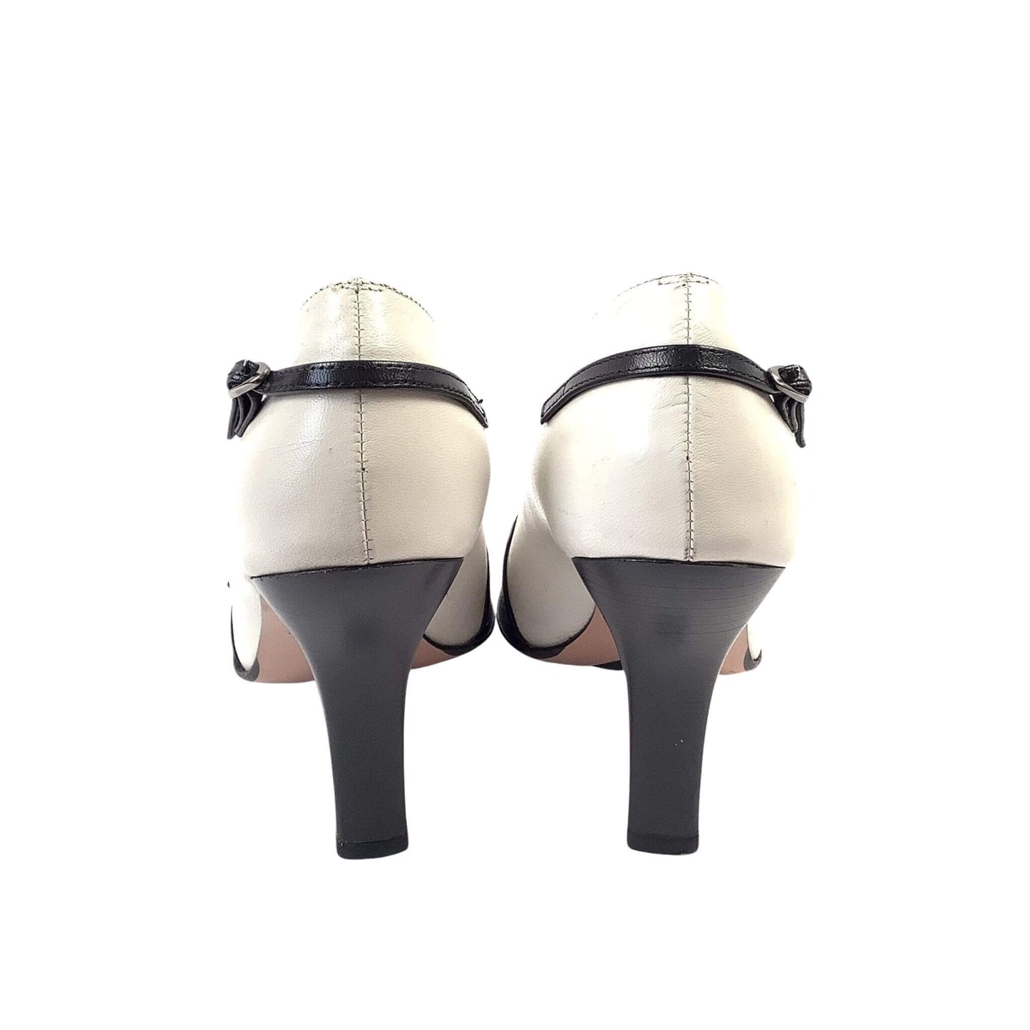 Pair of high-heeled black and white heels back-view