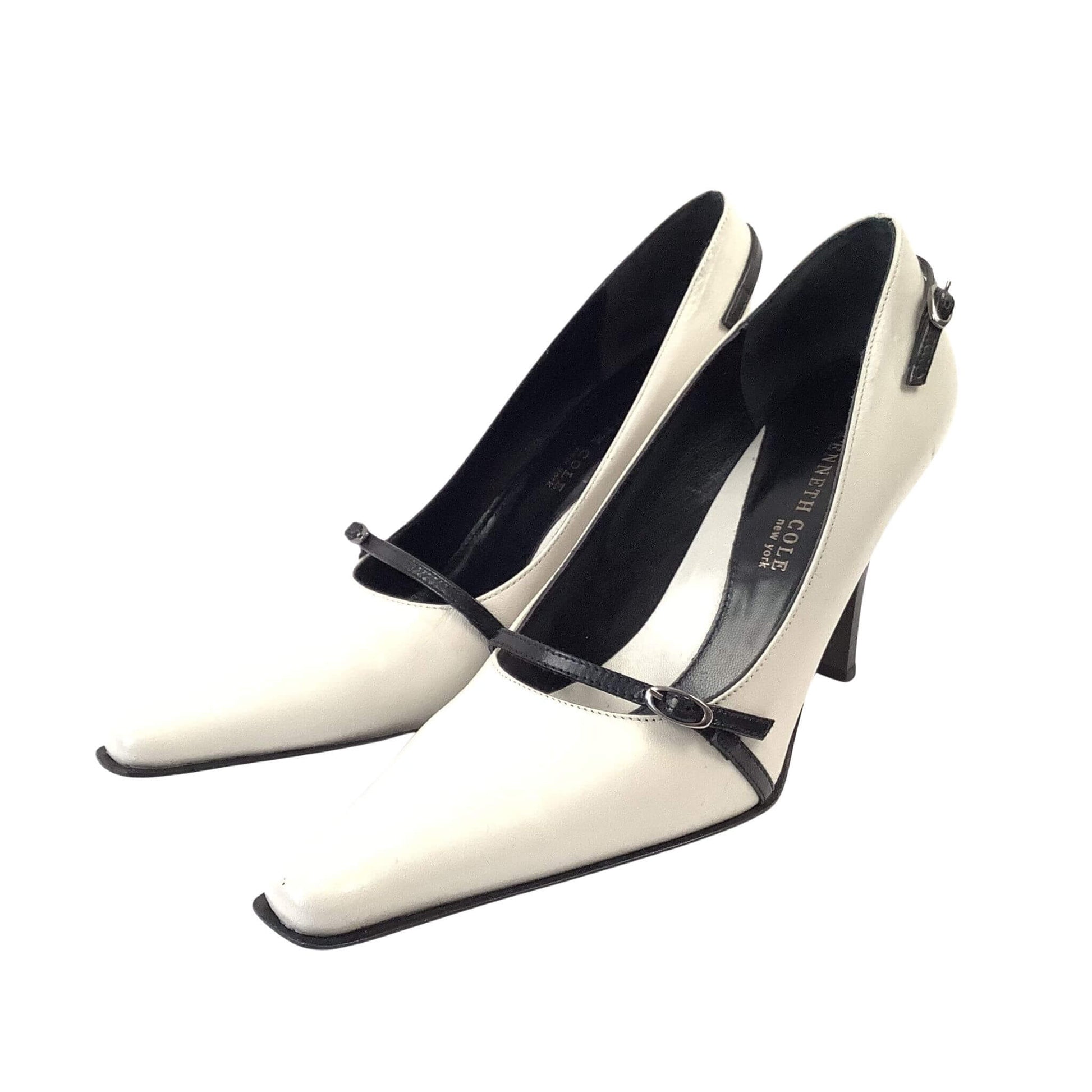 Pair of black and white high-heeled shoes right-side view