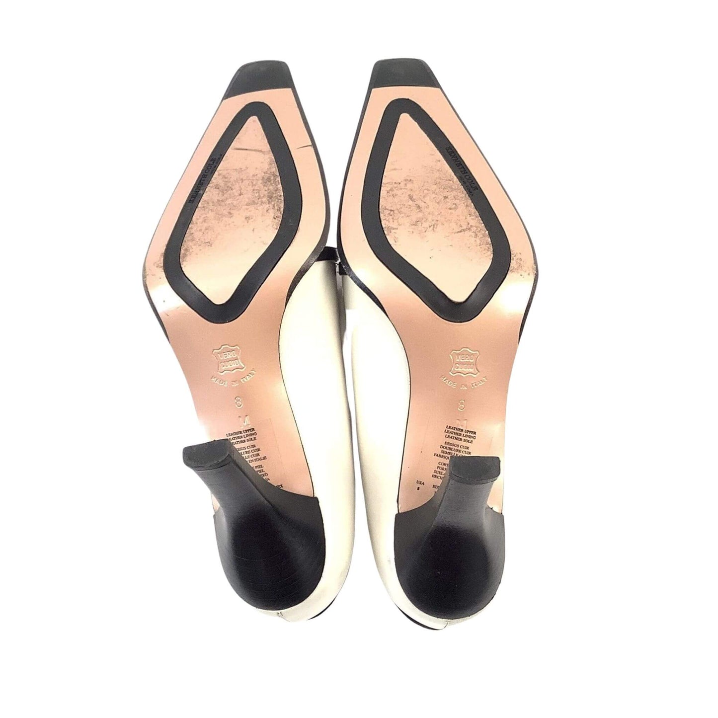 Pair of high-heeled black and white shoes view of soles