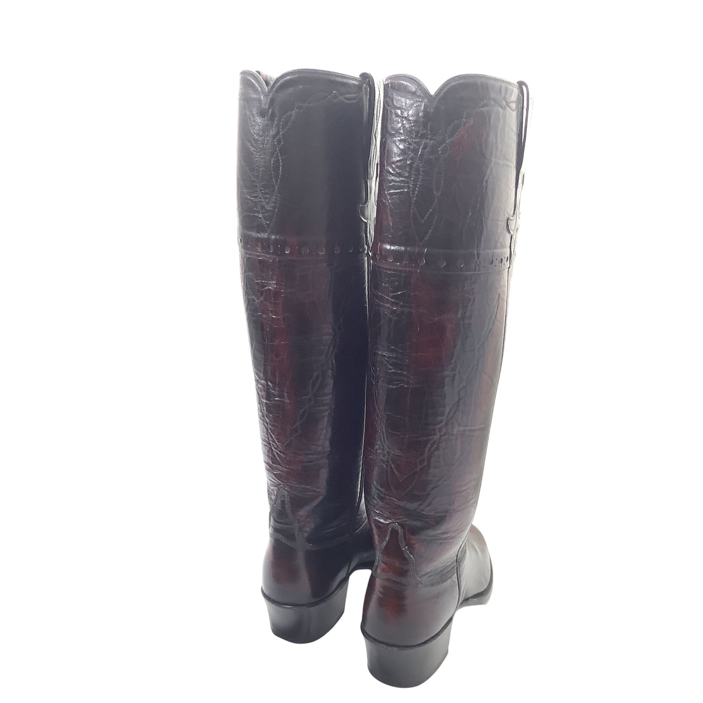 Vintage Lucchese reddish-brown leather boots with decorative western stitching, back view.