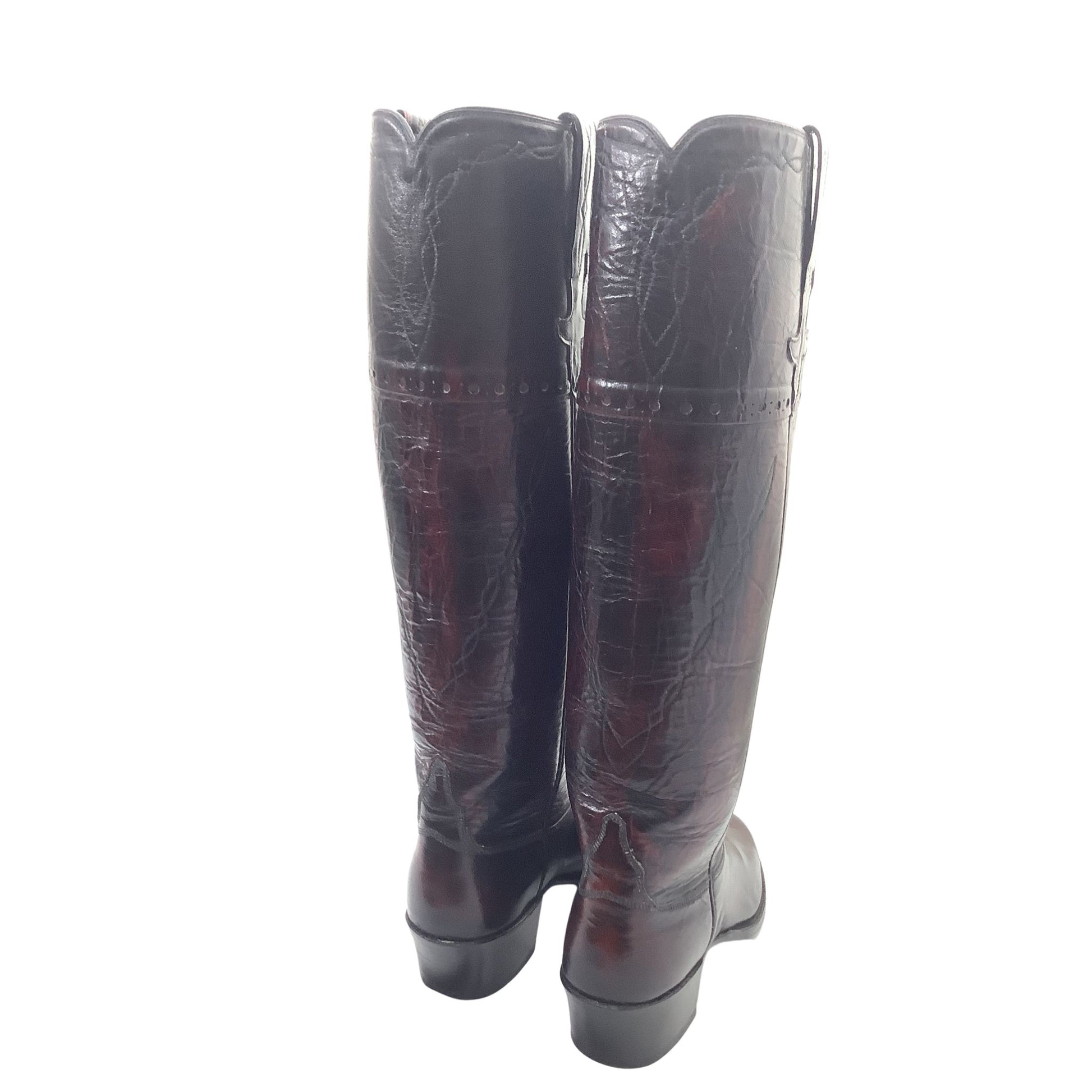 Vintage Lucchese reddish-brown leather boots with decorative western stitching, back view.