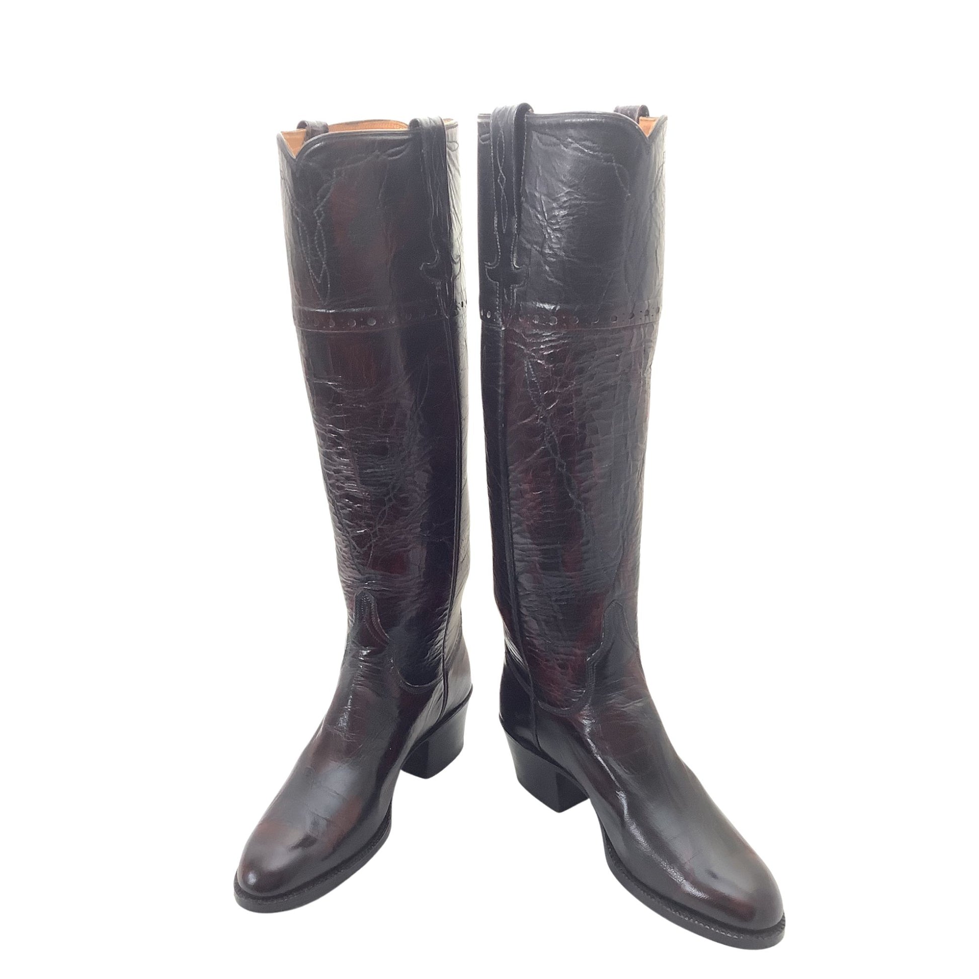 A pair of Lucchese dark brown leather tall boots with a glossy, crinkled texture. Front side view.