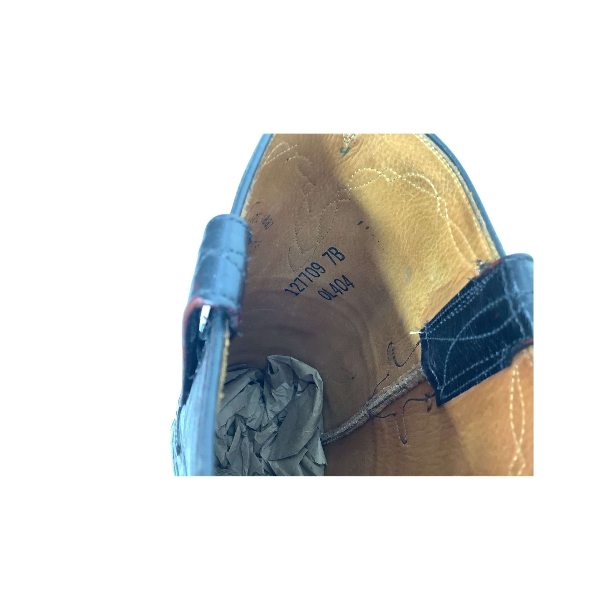 Interior close-up of Lucchese boot showing identification numbers.