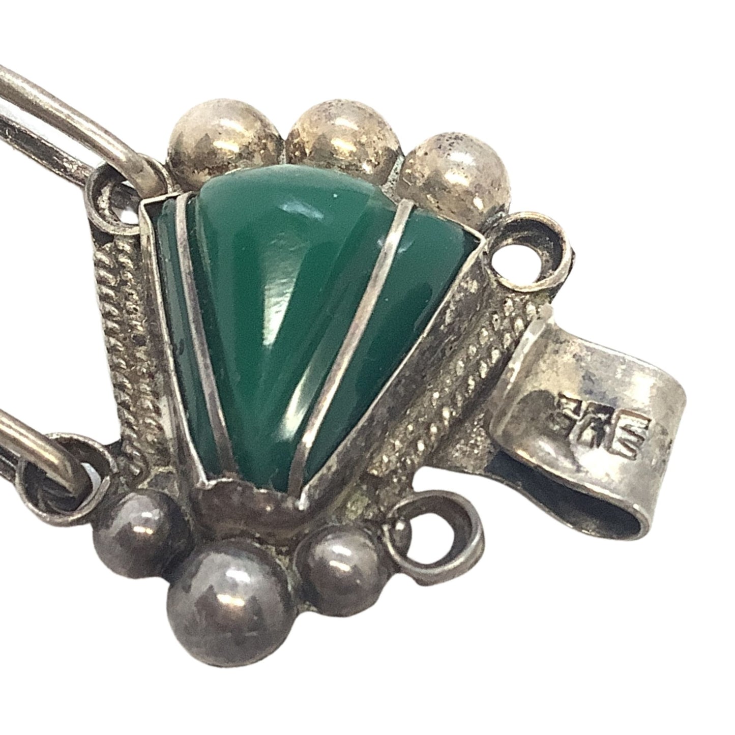 Malachite triangle stones close-up on a white background