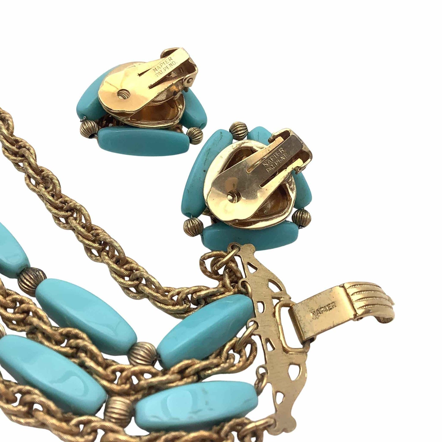 Turquoise and gold jewelry set signature view