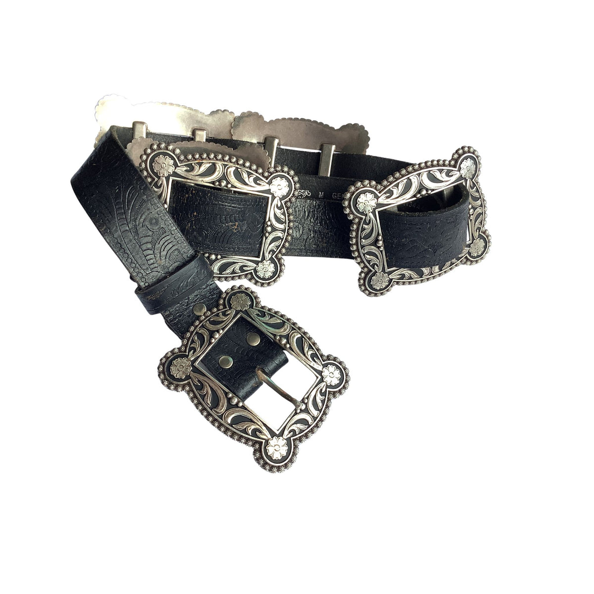 Nocona black leather western-style belt with ornate silver-tone metal buckles and decorative engraved details, shown on a plain white background.