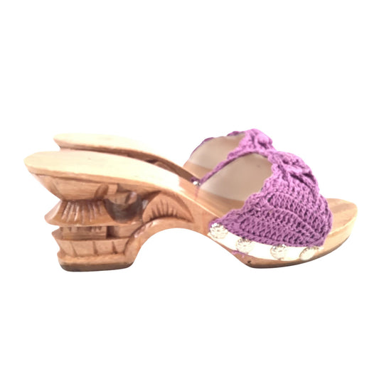 Side view wooden sandal with a purple crochet cover on a white background