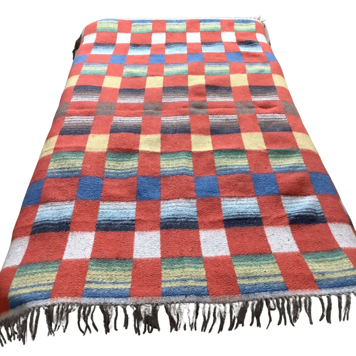 Overview of a vintage blanket in a red-multicolor checkered pattern.