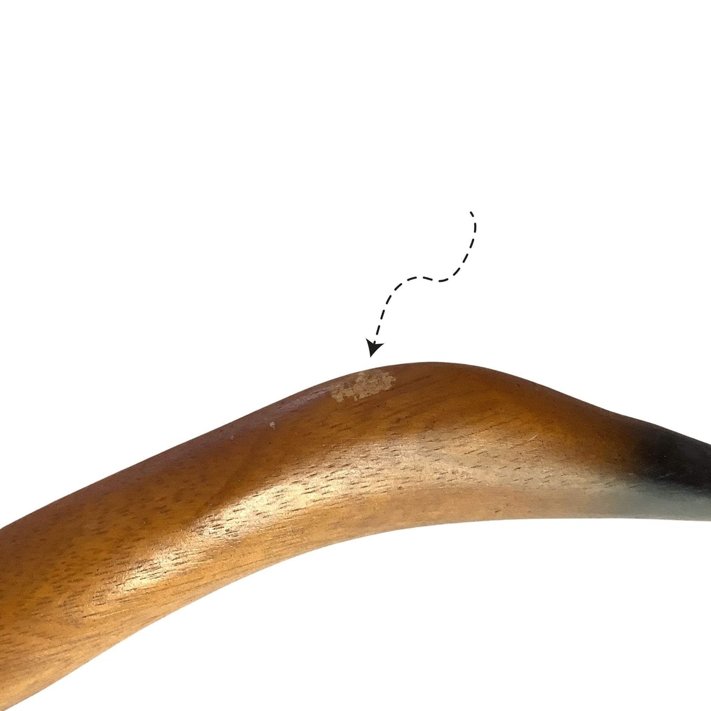 Close-up of scuff on wooden goose, labeled with a dashed line and arrow.