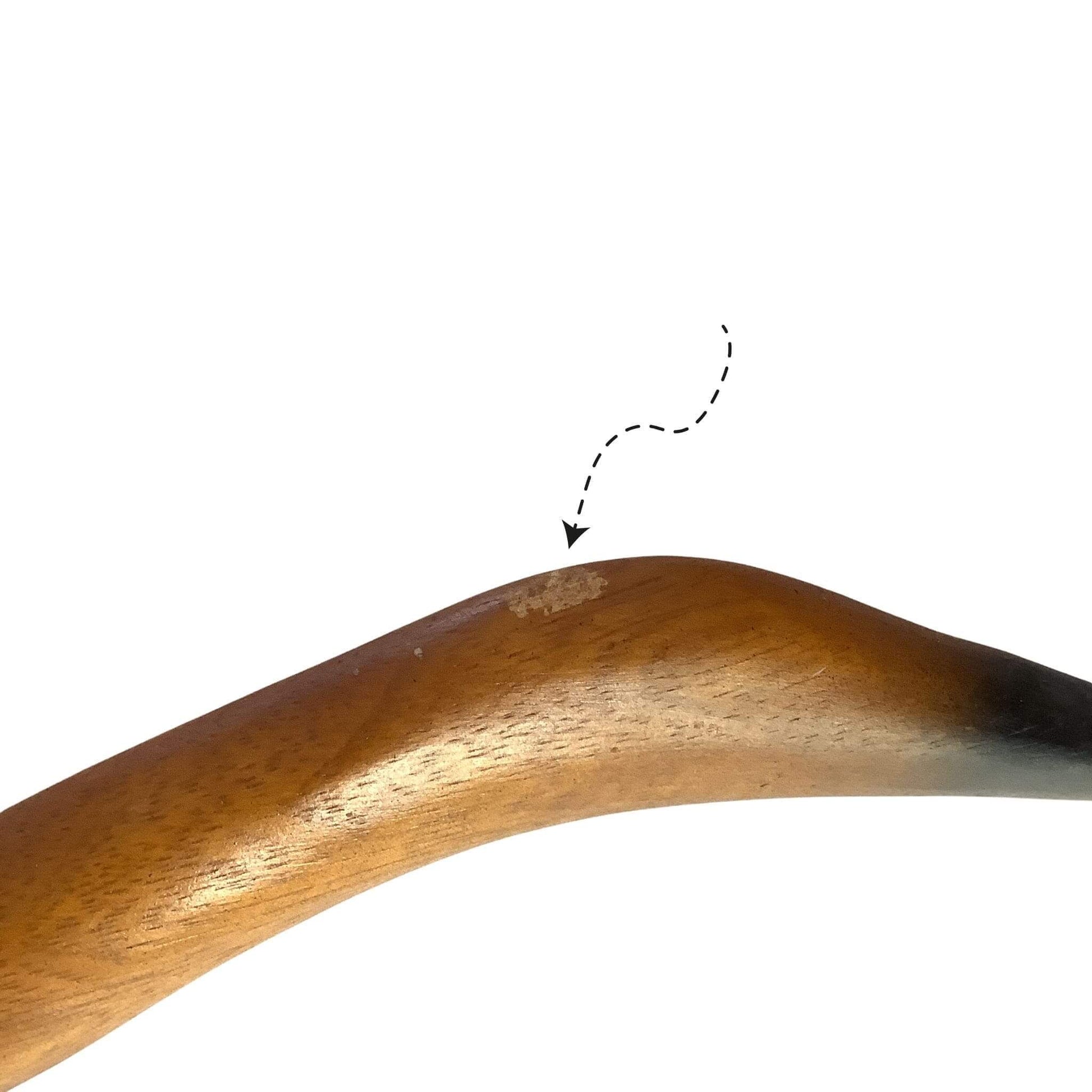 Close-up of scuff on wooden goose, labeled with a dashed line and arrow.