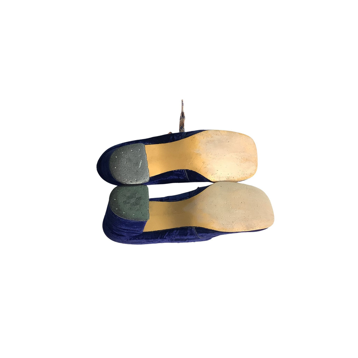 Pair of shoe soles with blue velvet upper design on a white background