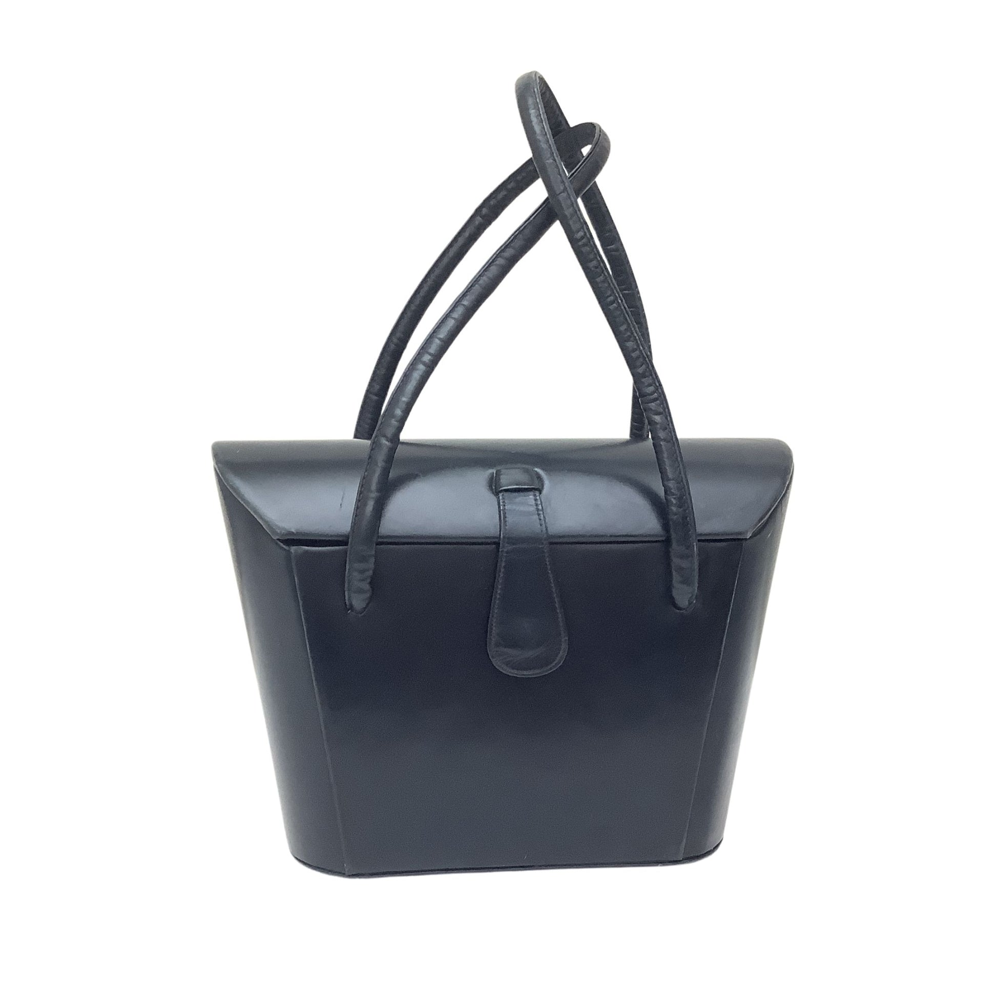 A structured navy leather handbag with a top handle and a front strap detail, shown against a plain white background.
