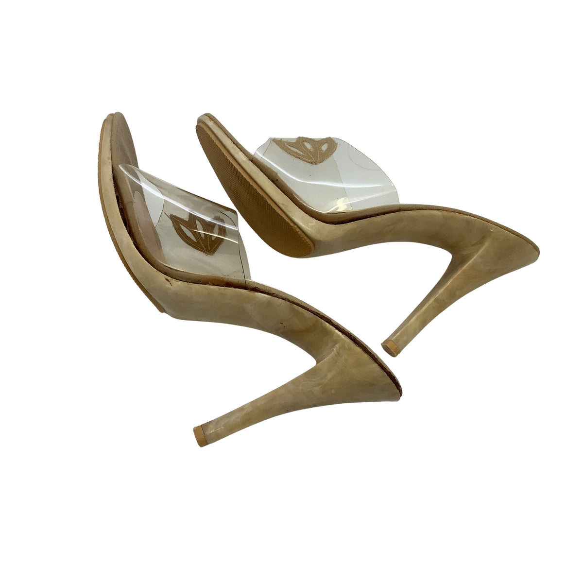 A pair of women's vintage pin-up high-heeled sandals in beige with clear transparent straps, flat side view.