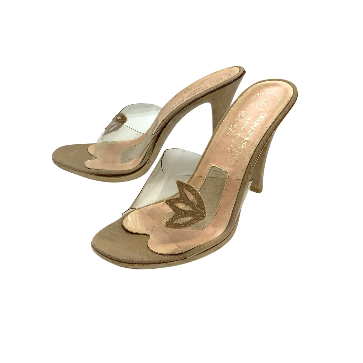 Women's vintage 1950s heeled mule heels with clear transparent straps, a metallic beige leather accents, and a stiletto heel.