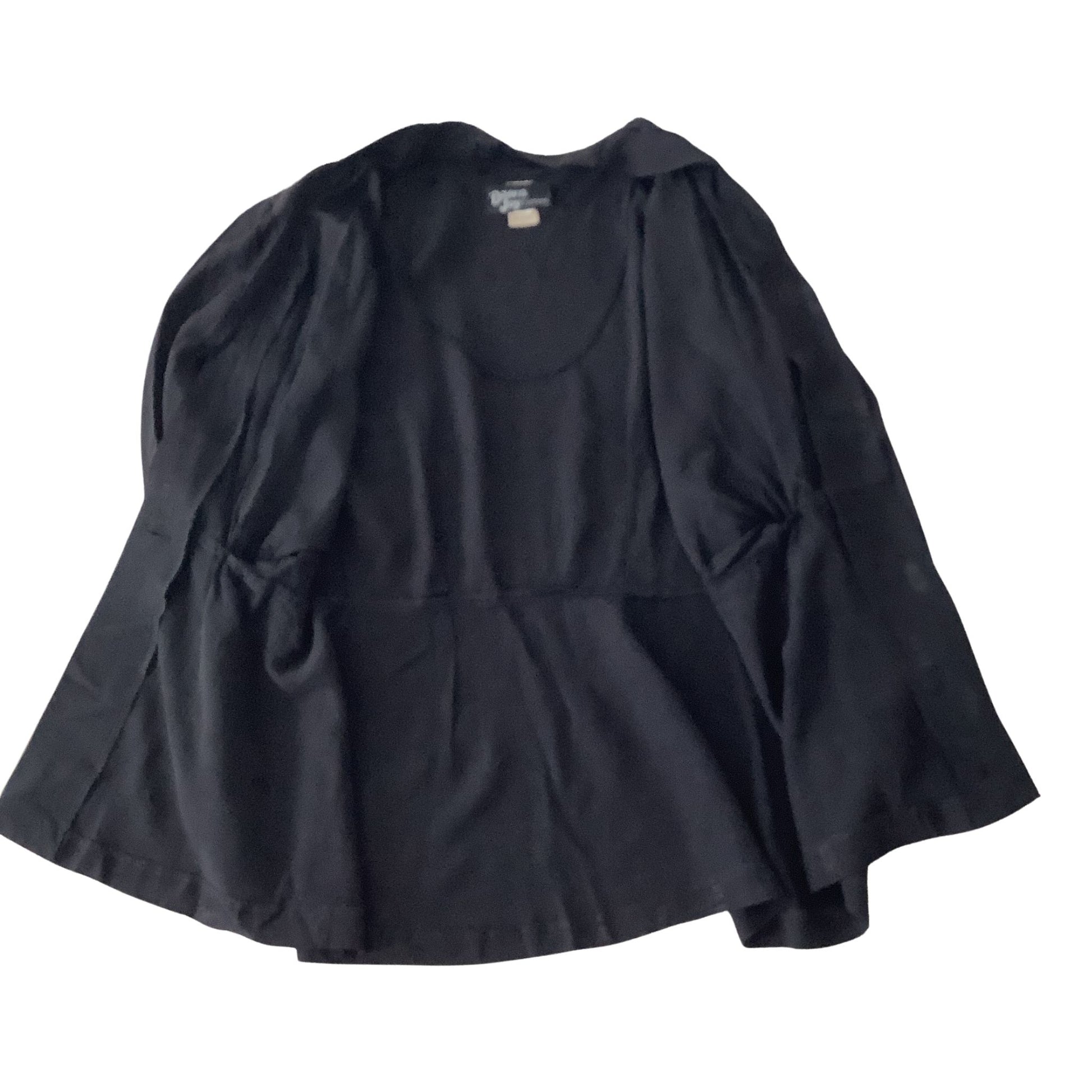 interior viw of vintage black jacket with long-sleeves, and a peplum-style waist, shown flat against a white background.