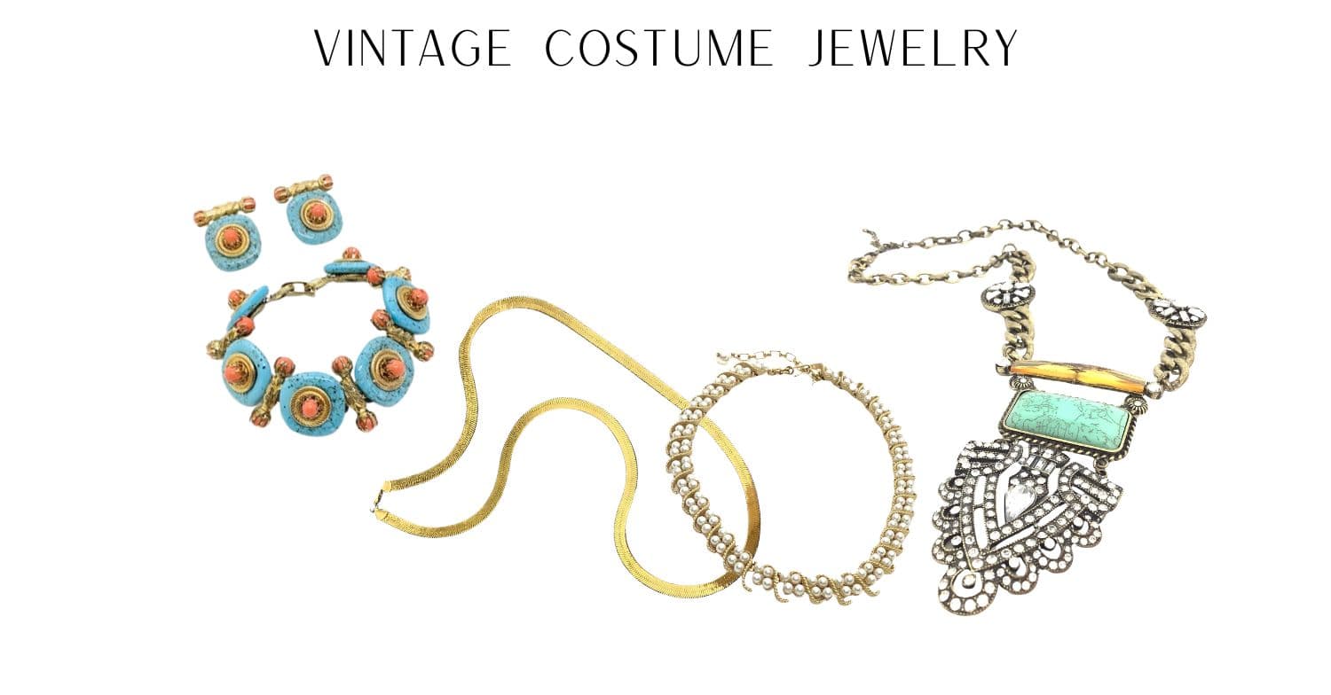 Vintage costume jewelry including a necklace, bracelet, and ring on a white background.