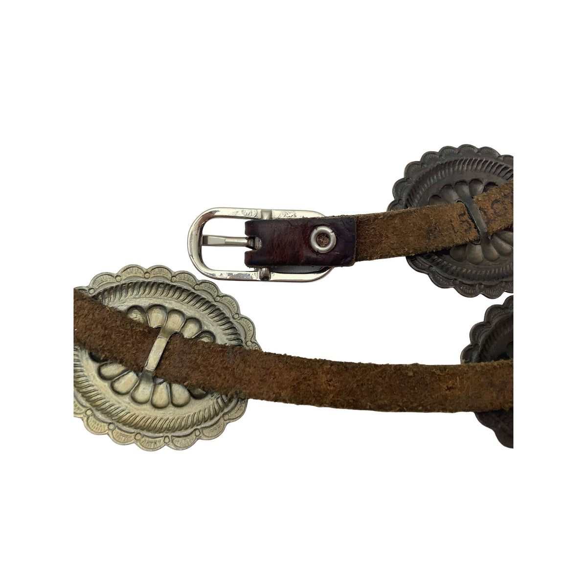 A close-up of a brown leather western-style belt with large silver-toned engraved conchos and a silver buckle, shown against a plain white background.