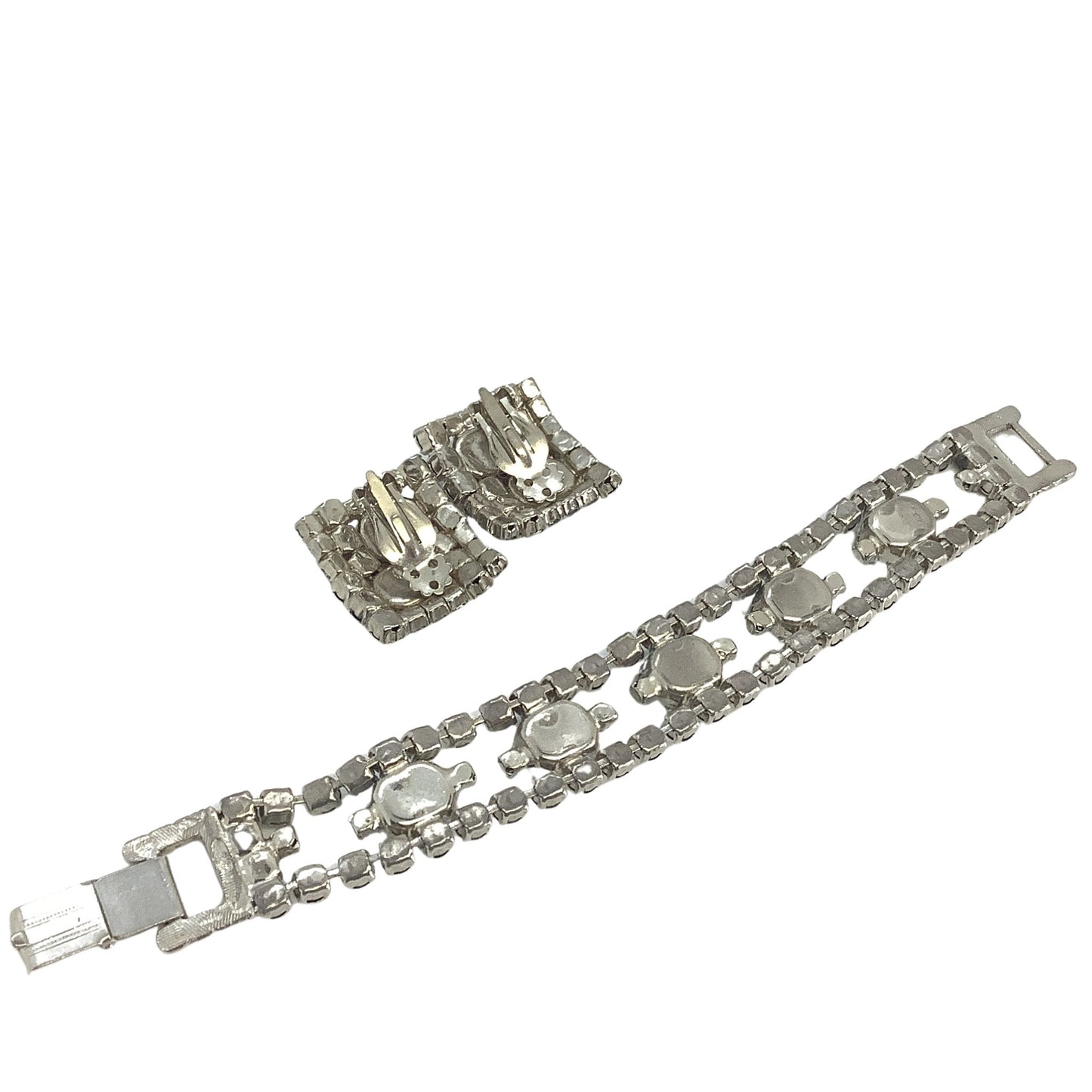 Back view of bracelet and earrings set on a white background
