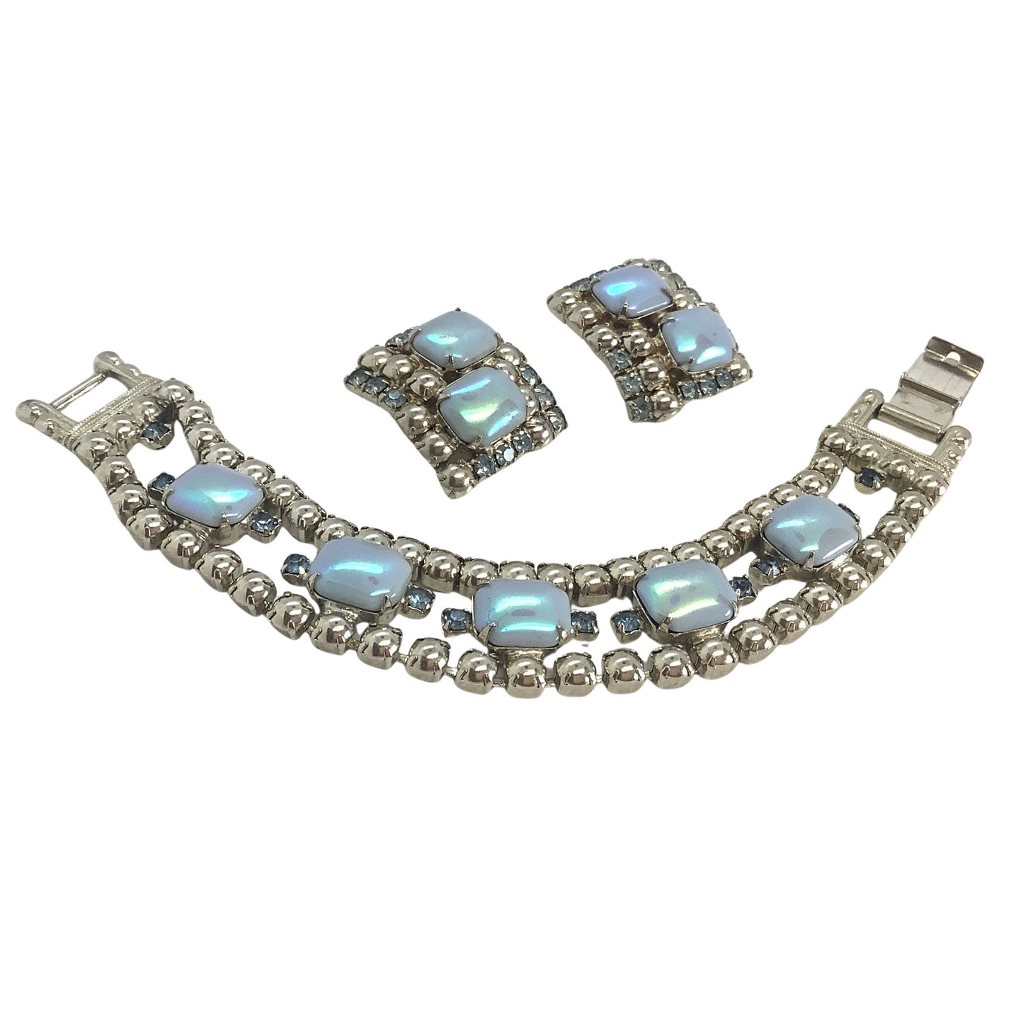 Jewelry set with necklace and earrings featuring blue moonstones on a white background