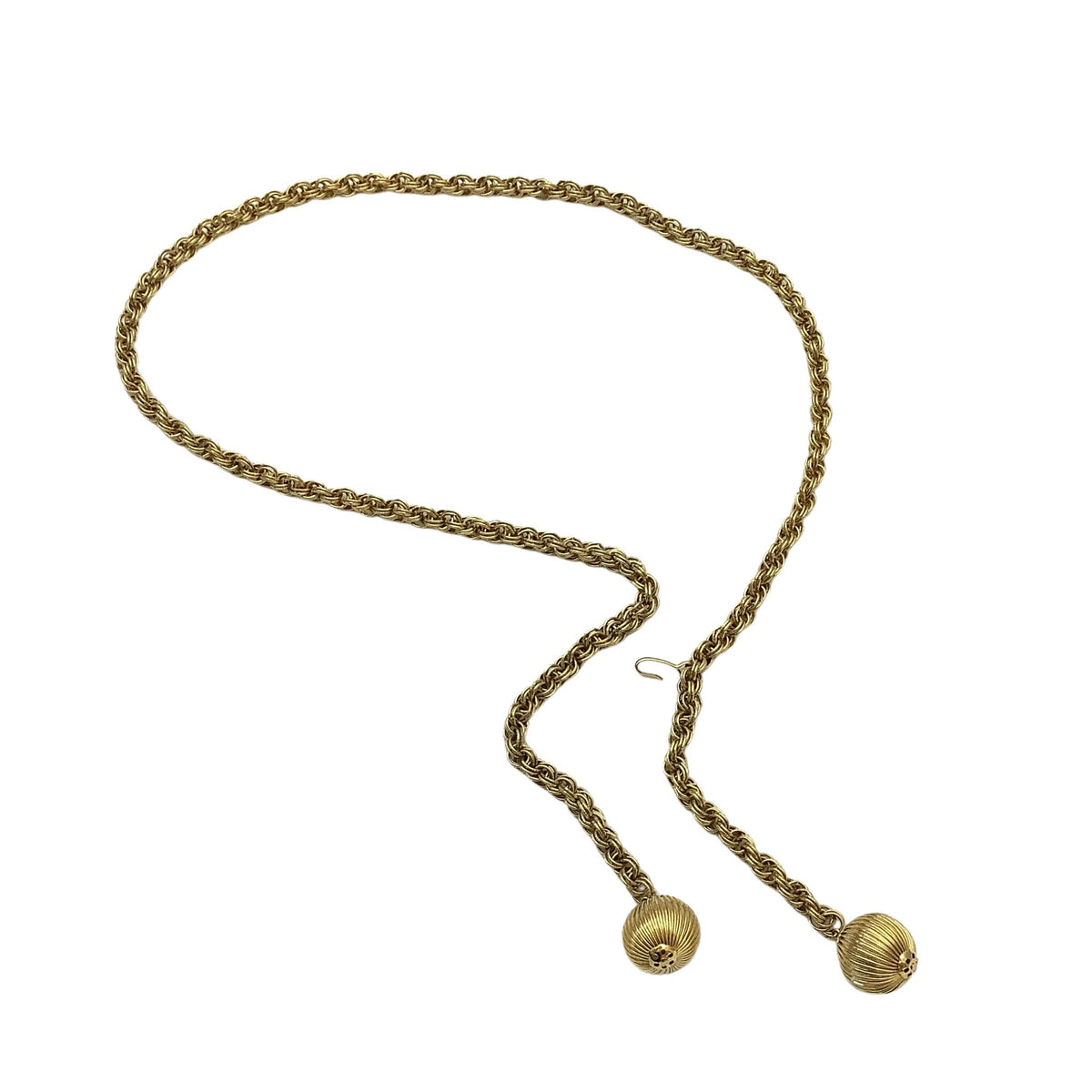 A vintage gold-toned braided chain belt with two ribbed spherical bead pendants and a small hook clasp, displayed on a clean white background.