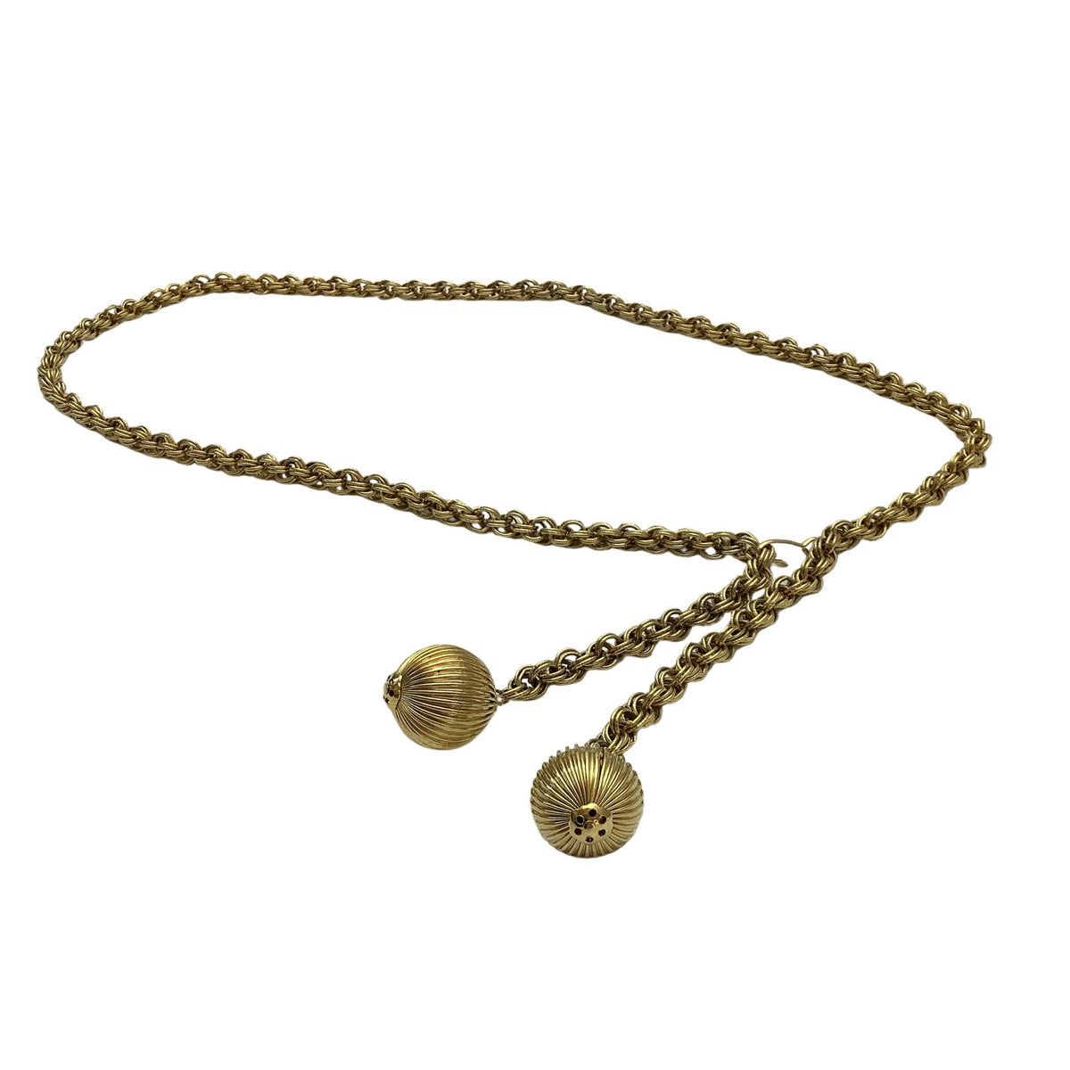A vintage gold-toned chain belt with two textured, ribbed spherical pendants, displayed on a clean white background.
