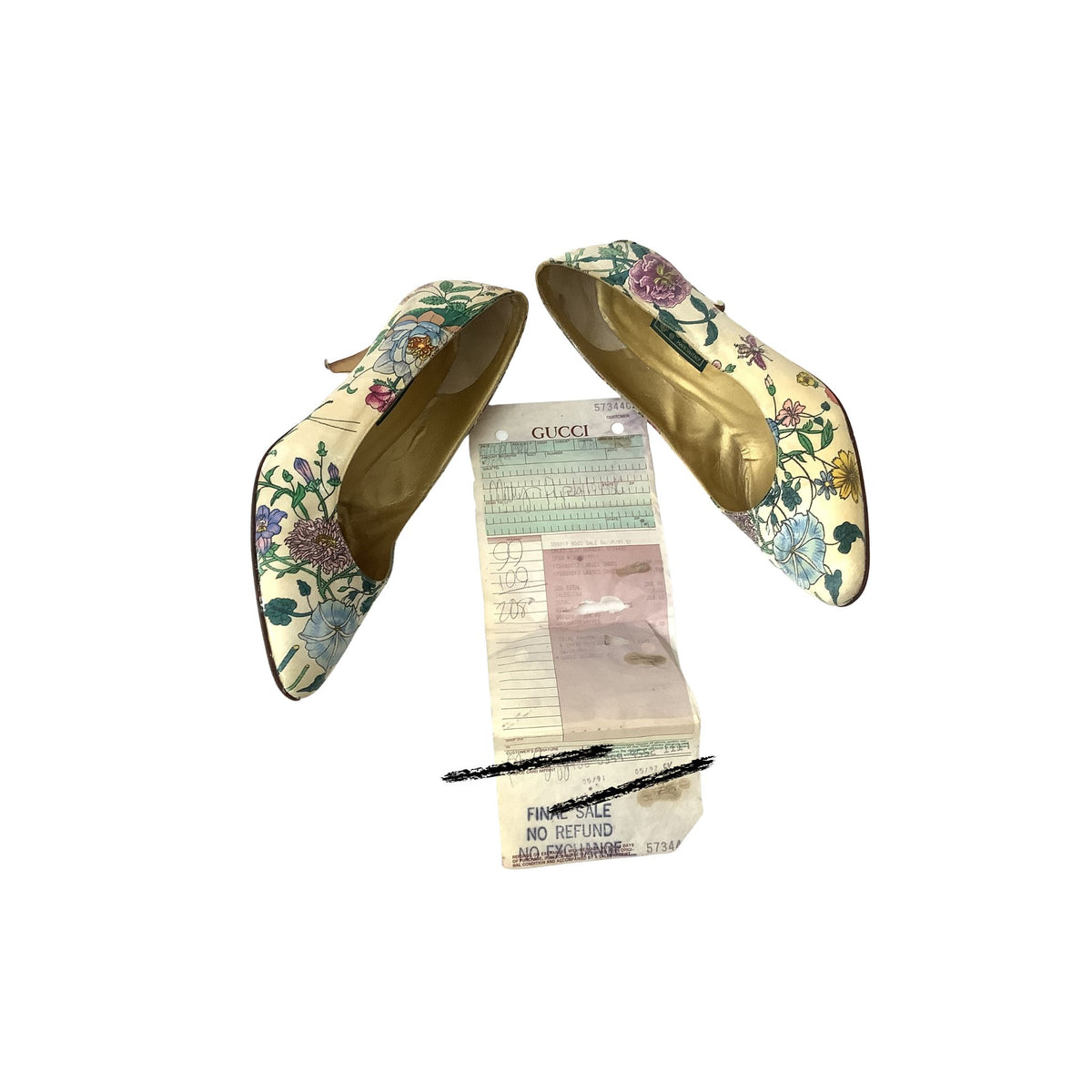 A pair of Gucci pointed-toe pumps with a floral print on a beige base, shown with their original box and a receipt on a plain white background.