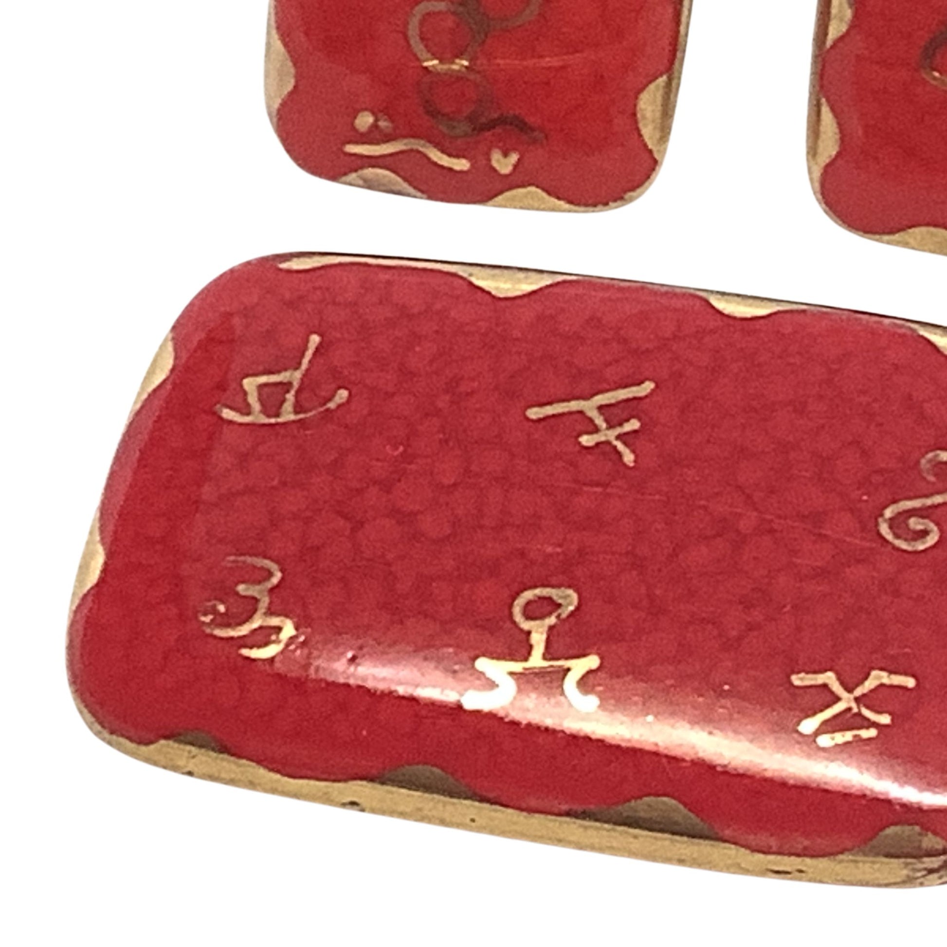 Vintage Hand Painted Red Gold Pin Close-up on a white background