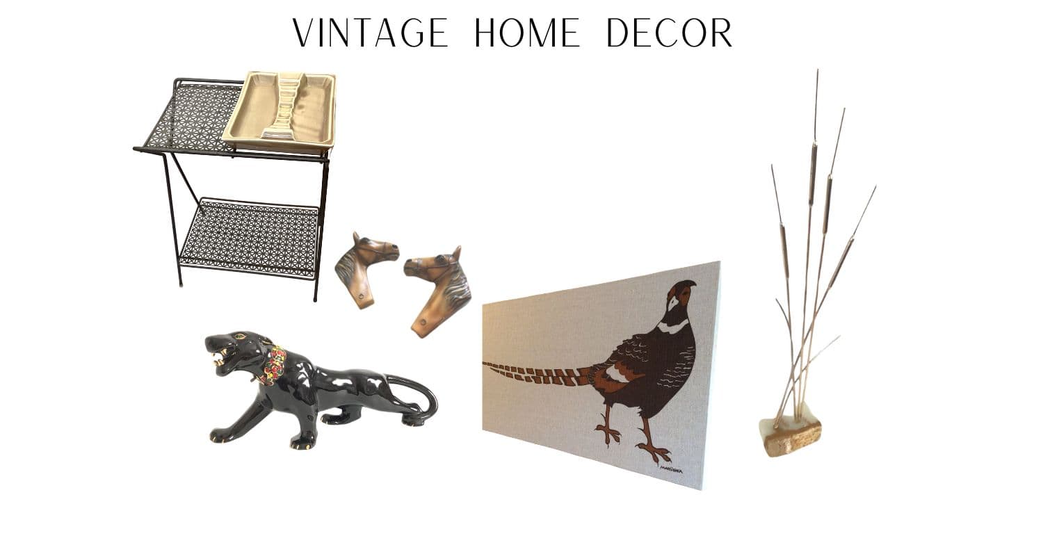 Collection of vintage home decor items including a metal table, animal figurines, and decorative cards on a white background.