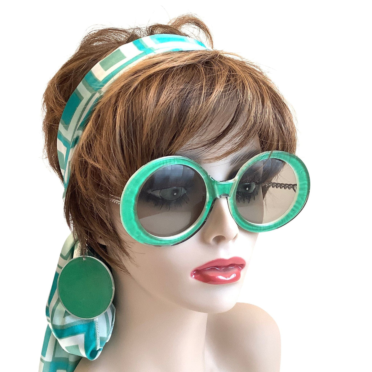 Vintage Je Dol Green Round Sunglasses with attached earrings on a mannequin.