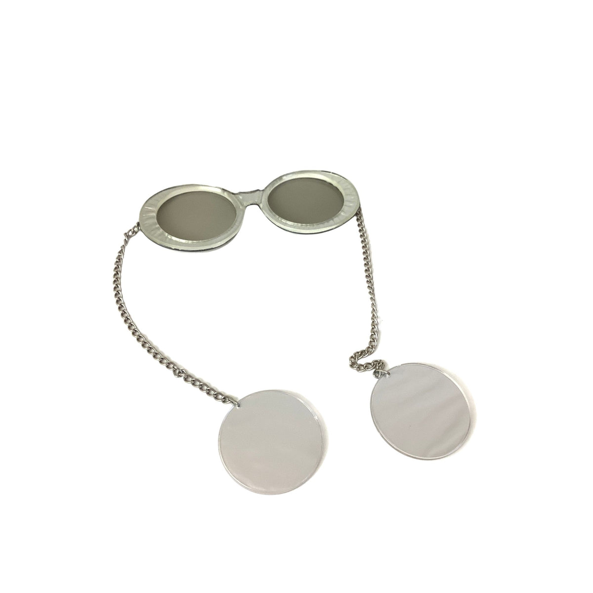 Silver novelty sunglasses with oval frames, a short chain, and two round silver-tone discs hanging from the chain, shown on a plain white background.