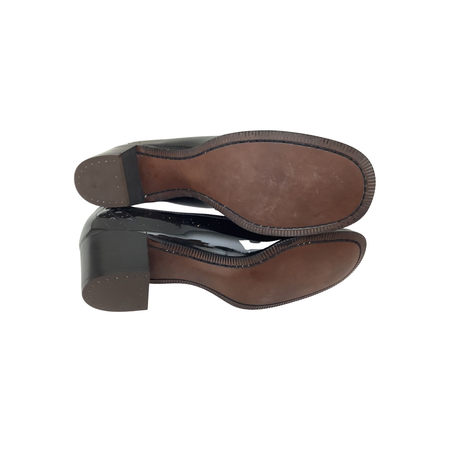 A pair of black leather shoes shown from the sole view, displaying the brown insoles and block heels against a plain white background.