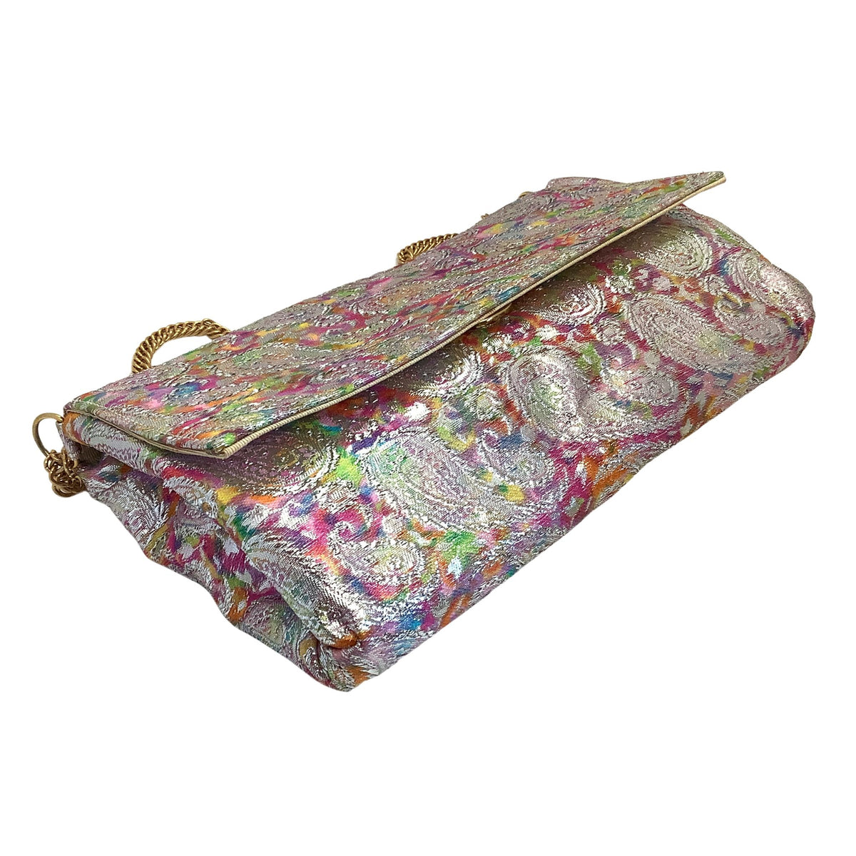 Frenchy of  California metallic silver clutch bag with a vibrant multicolor paisley brocade pattern, featuring gold-tone chain handles, set against a plain white background.