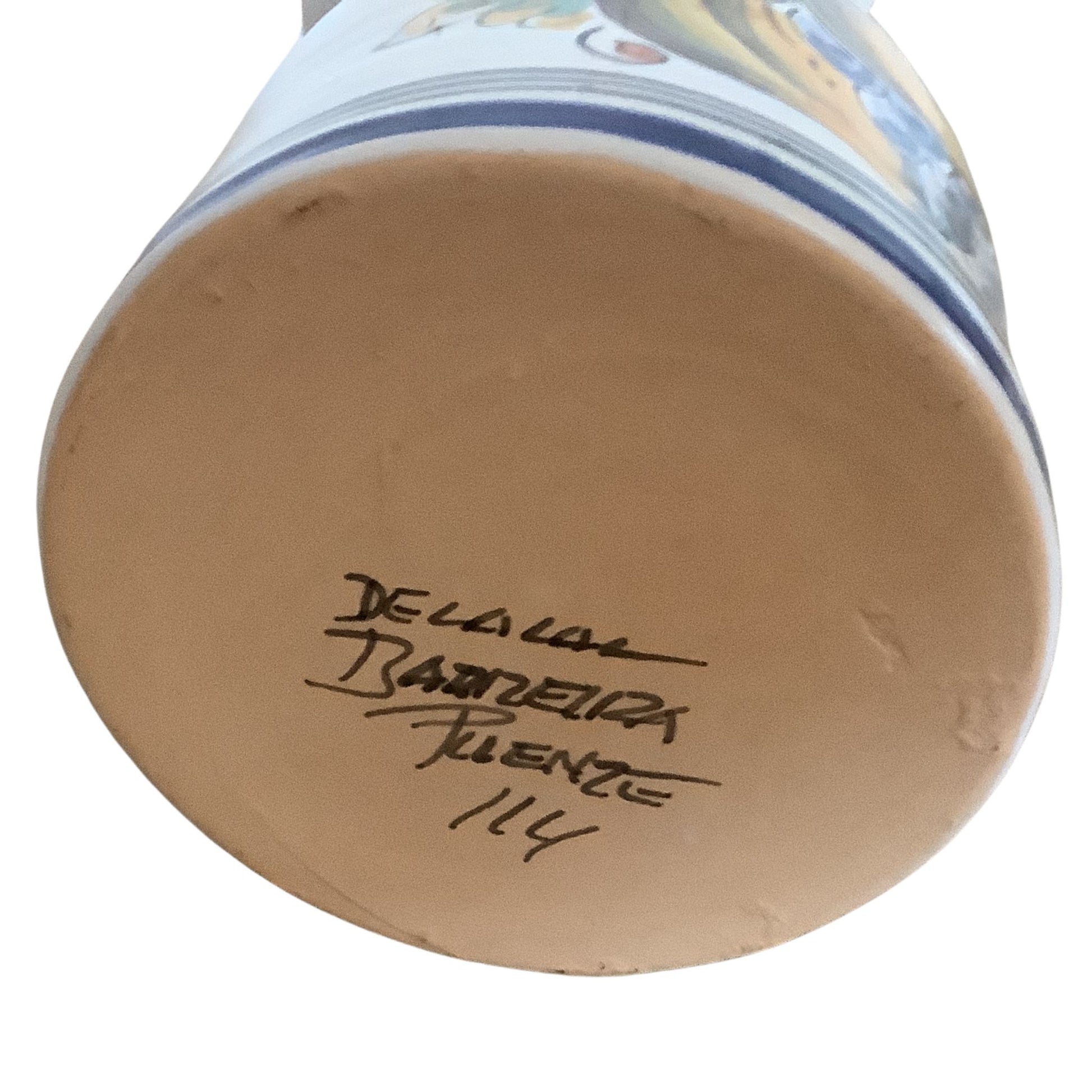 Ceramic sangria pitcher bottom view with artist signature on white background