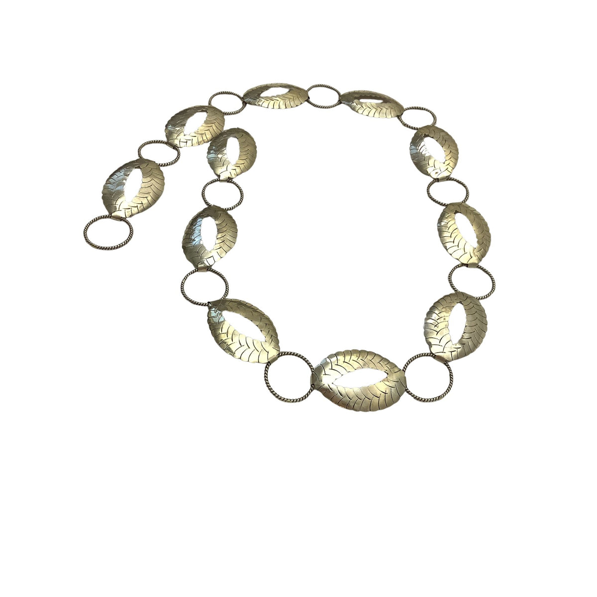 A Boho/western-style metal belt featuring hammered oval links with a textured, metallic gold finish, connected by small silver-toned rings.