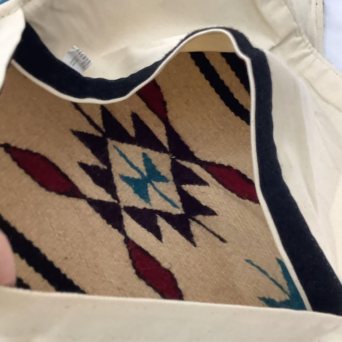 Interior view of a Southwestern pillow cover showing the woven wool construction
