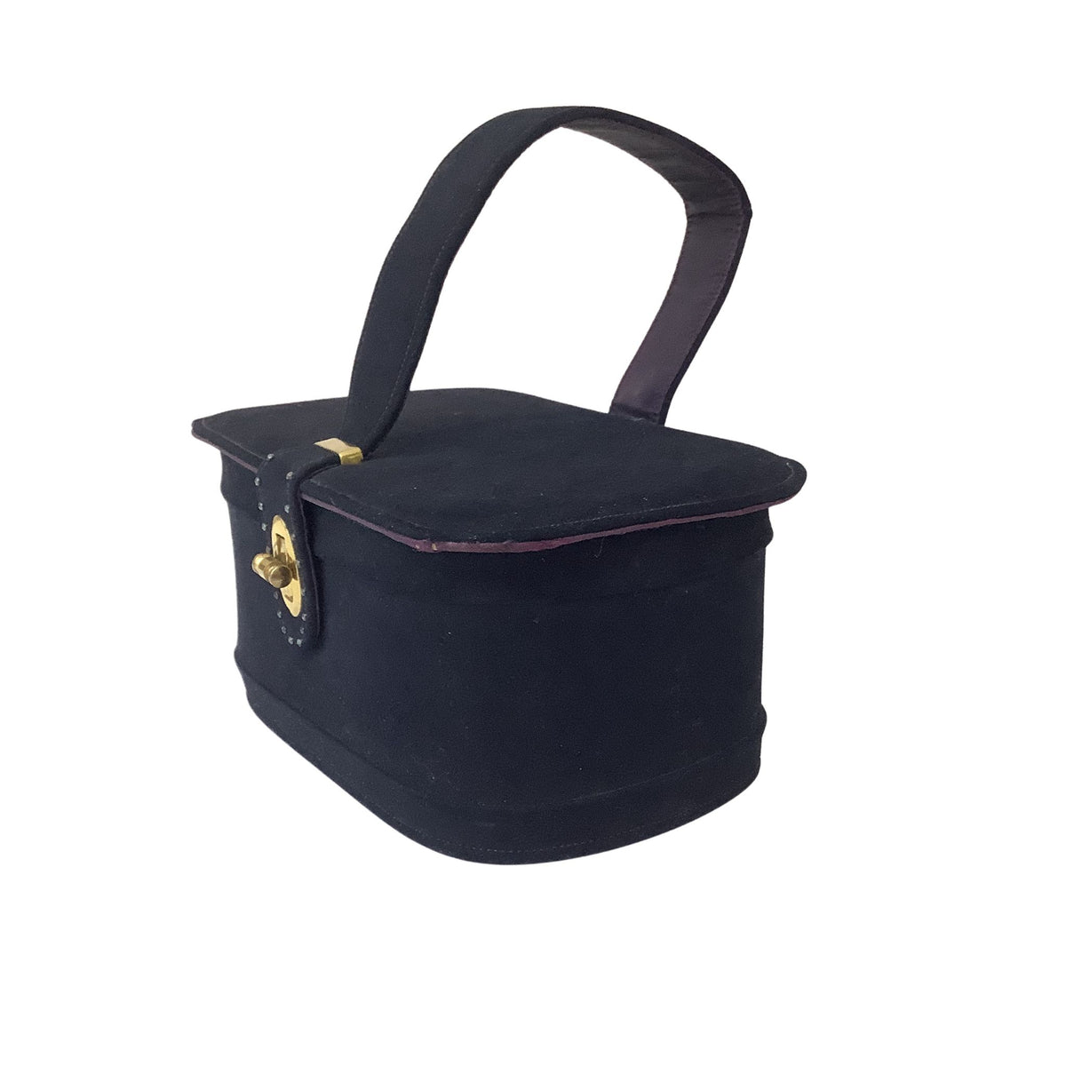 Side view of vintage Stylecraft handbag with a top handle, gold-tone clasp