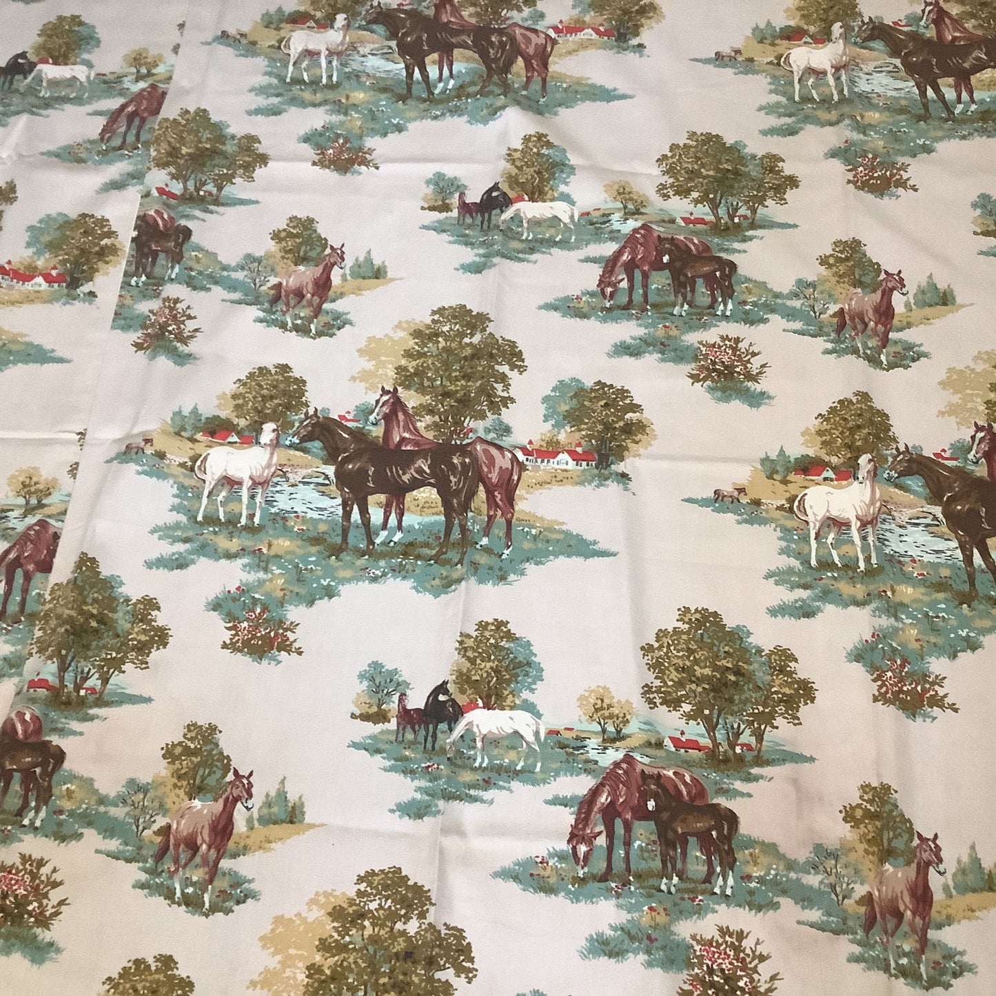 A close-up of a western patterned curtain featuring a repeating equestrian landscape print with horses, trees, and barns.