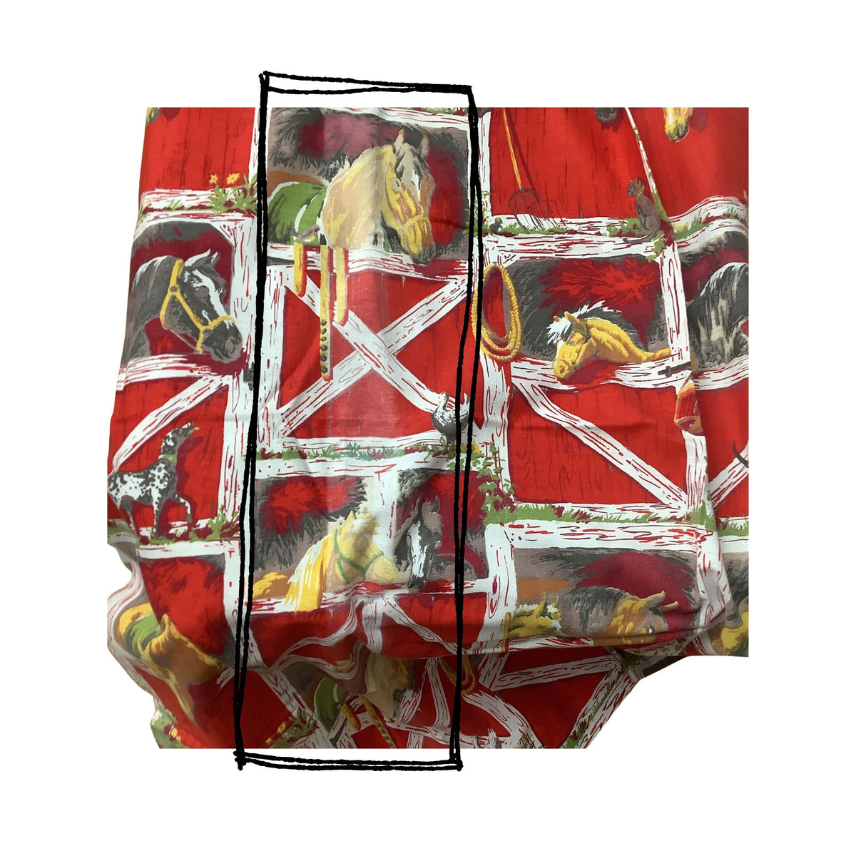 Vintage western curtains with black graphic shape showing discoloration featuring a western barn and horse pattern.