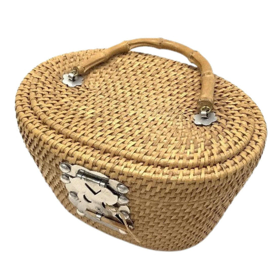Vintage woven reed basket with chromed hardware.