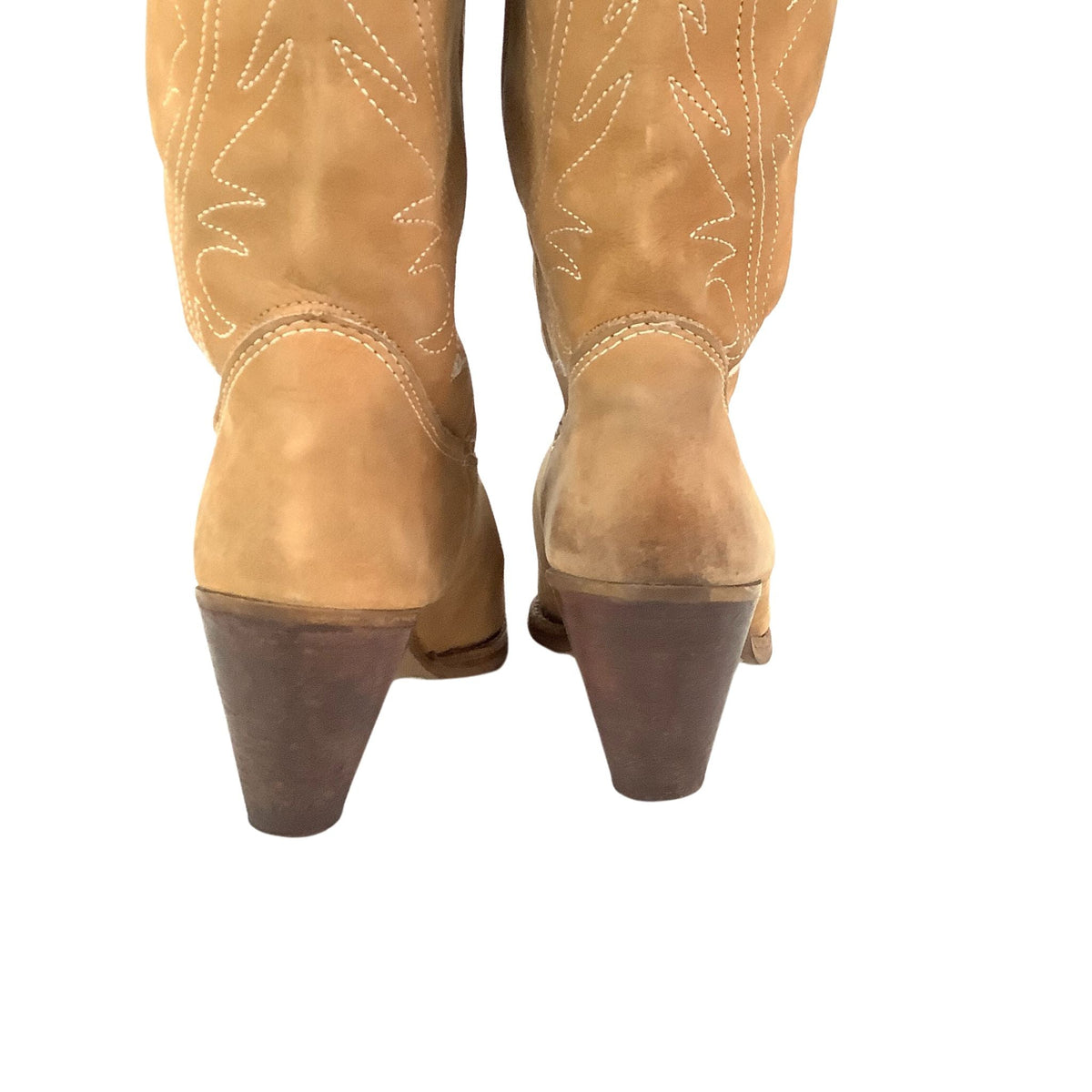 A pair of tan suede cowboy boots with white embroidered stitching, shown from the back against a white background.