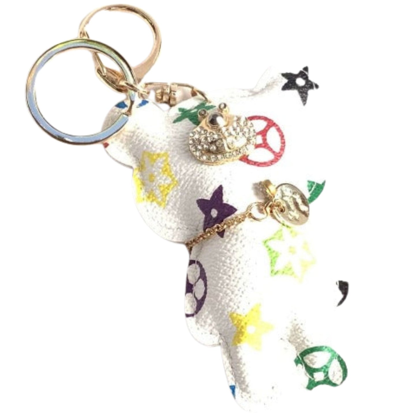 White teddy bear charm with colorful star and peace sign charms on a white background