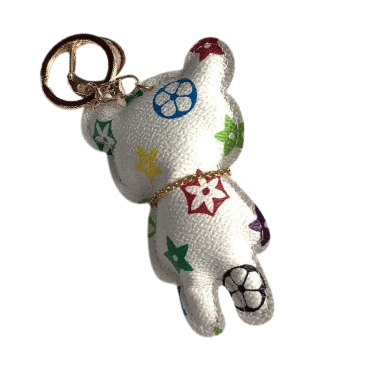 White teddy bear keychain with colorful patterns.