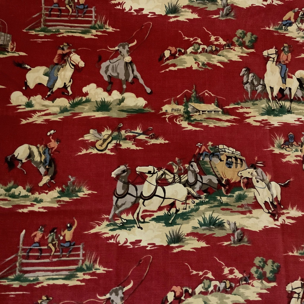 Close-up of vintage Waverly Wild West Red fabric with a detailed cowboy and cattle ranch print featuring horses, riders, a wagon, and stagecoach in cream, green, and blue.